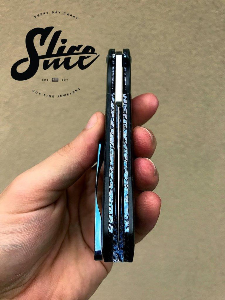 **SOLD** Olamic Rainmaker with zirconium and blue shred carbon fiber.